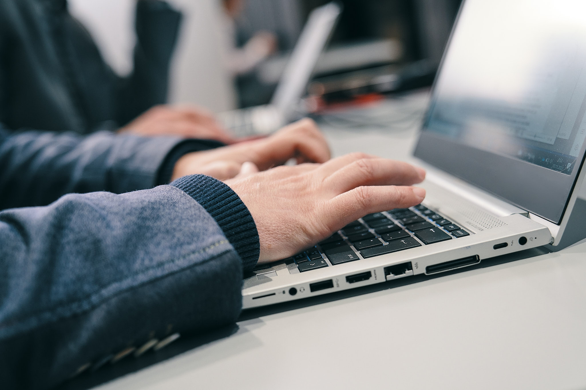  A person typing on a computer.